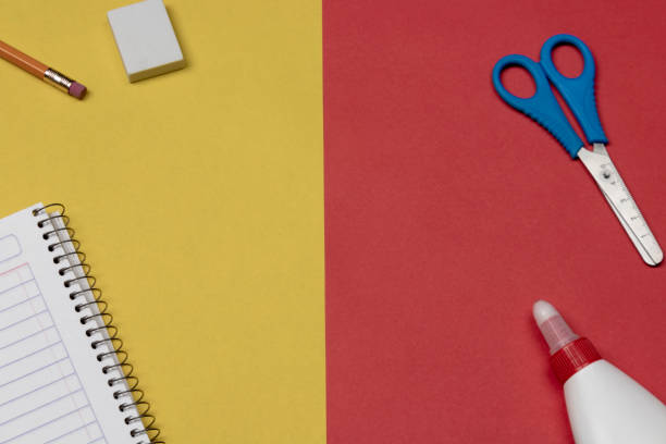istock School supplies on 2 color flat lay background 960389096
