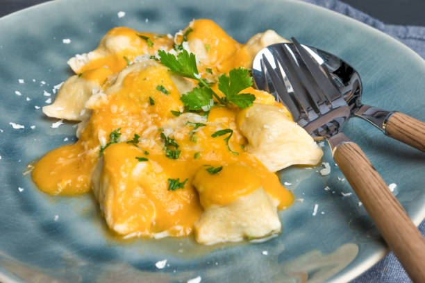 istock Homemade ravioli cooked served with tomato sauce. 960406256