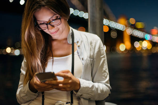 istock Girl watching photos on cellphone 960419448