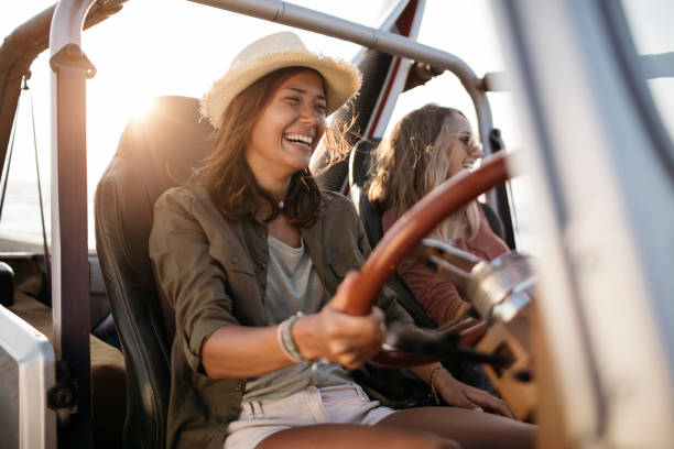 istock Two girlfriends driving to the beach 960419484