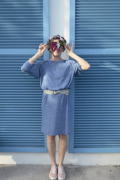 istock Woman on front of the blue wall. 960420362