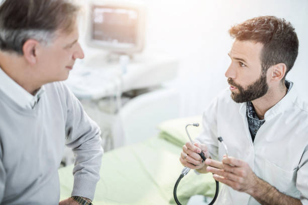 istock Senior male patient talking with his doctor. 960420522