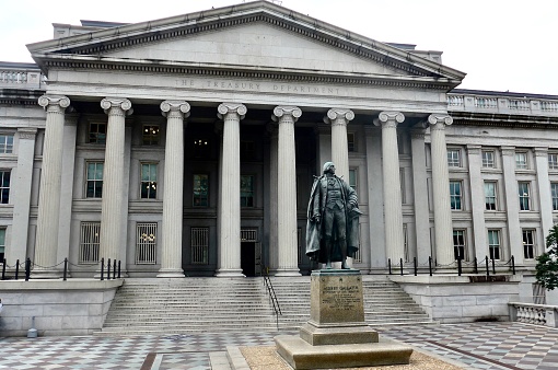Bronze statue of Albert Gallatin (1761-1849), the longest serving US Secretary of Treasury, stands before the Treasury Department in Washington, DC.