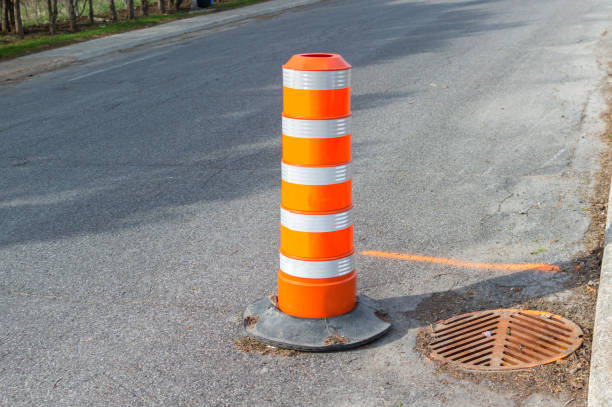 The orange traffic cone on the sidewalk in Montreal downtown