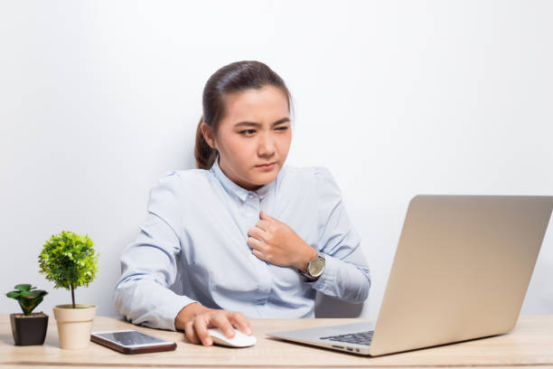 Woman has chest pain after hard work Woman has chest pain after hard work Asia Pacific Security Awareness Computer based Training stock pictures, royalty-free photos & images