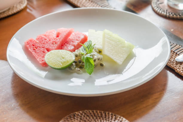 istock Appetizer fruits in template porcelain tableware with wooden table background 960440324