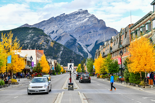 Street view of famous Banff Avenue in Banff National Park. Banff is a resort town and central shopping district of Alberta's most popular tourist destinations.