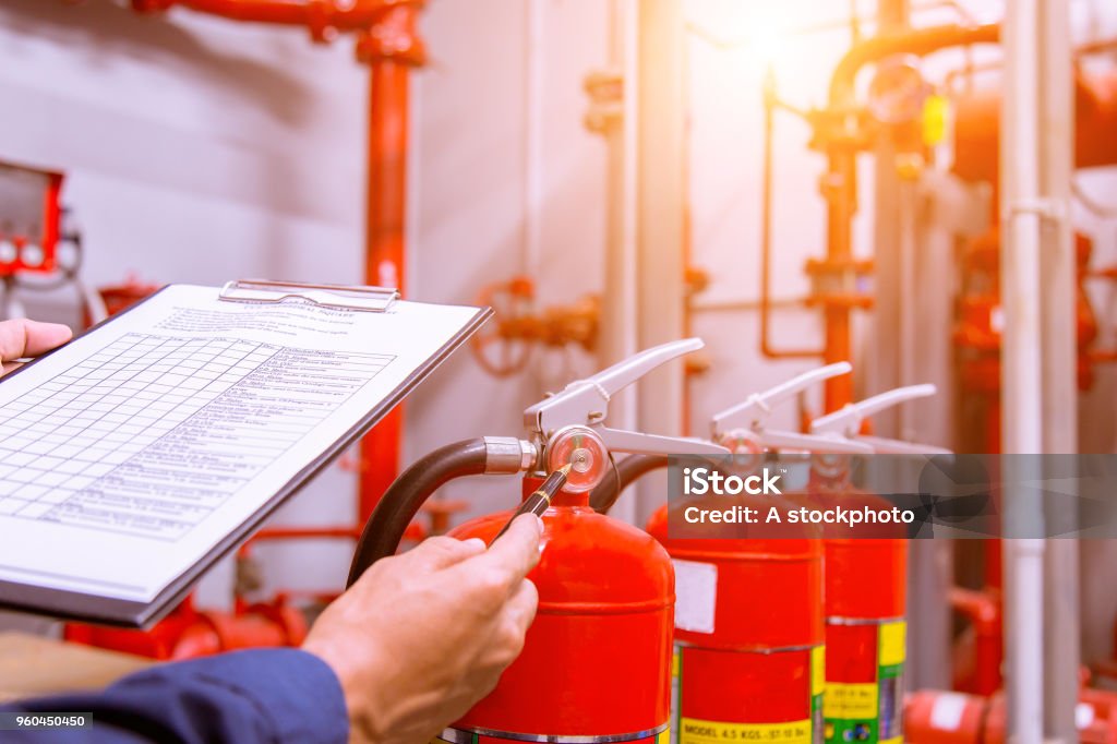 Engineer checking Industrial fire control system,Fire Alarm controller, Fire notifier, Anti fire.System ready In the event of a fire. Fire - Natural Phenomenon Stock Photo