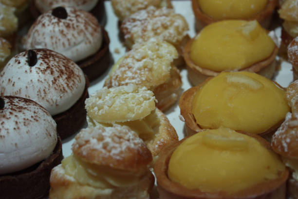 istock Dessert buffet  cake with cream and lemon tartlets 960453110