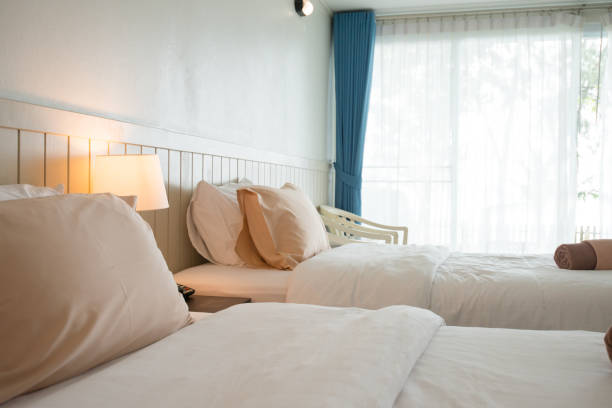 istock Interior in hotel room for bed and pillow with sunlight at the window 960455384