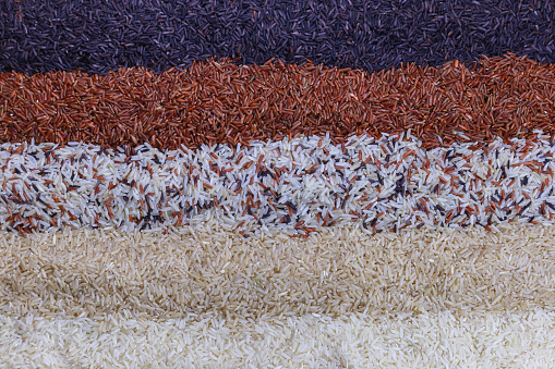 Food background with top view of five rows of rice.