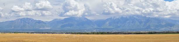 istock Panoramic view of Wasatch Front Rocky Mountains, Great Salt Lake Valley in early spring with melting snow and Cloudscape. Utah, USA. 960465374