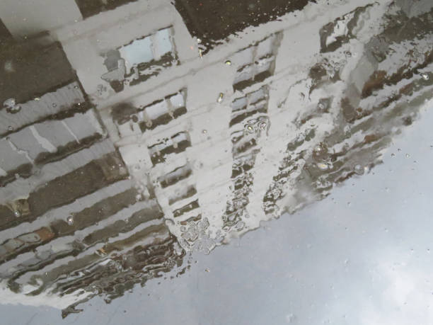 istock Reflection of the building in a puddle after rain 960466066