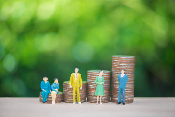 istock Mini human model standing with the growing coins stack with green nature background for business and finance concept 960471658