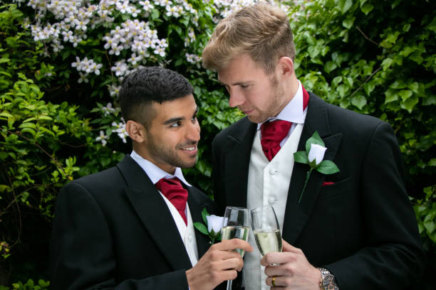 istock Gay couple at wedding reception toast being married 960479800