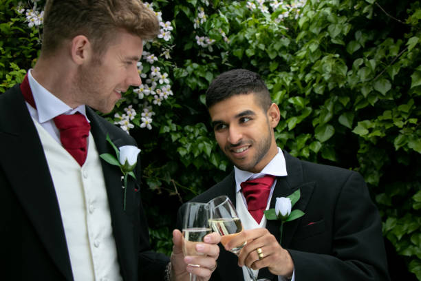 istock Gay couple at wedding reception toast being married 960480054