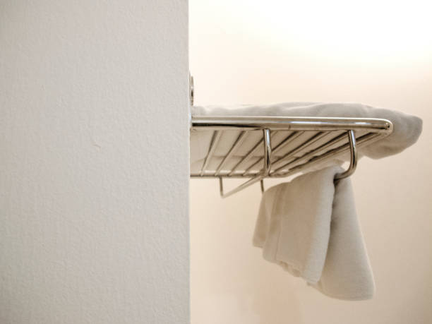 istock White Terry Towels Hanging on the wall in the bathroom / side view 960484090