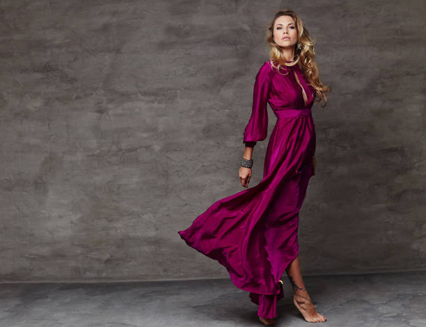 istock Blond female in red dress 960484418