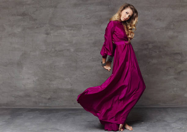 istock Female in long red dress 960484534