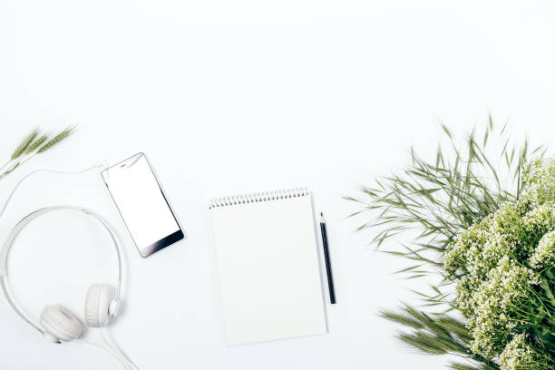 istock Blank notepad near bouquet of white wild flowers 960489030