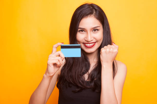 istock Young Asian woman with white blank sign. 960489420
