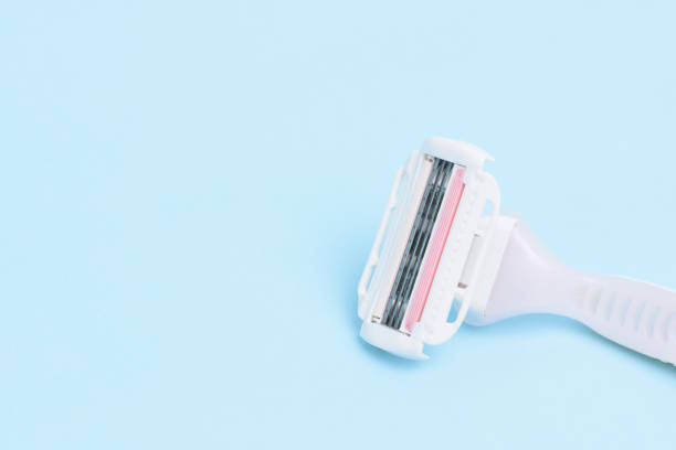 istock A lady shaver isolated on light blue background. 960494204