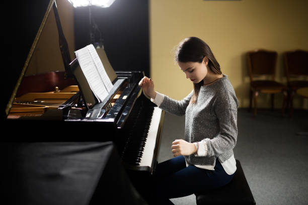 istock Woman playing piano 960496718