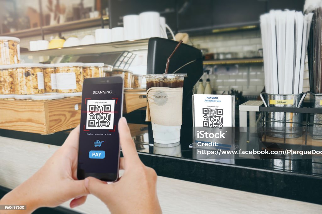 Qr code payment, E wallet , cashless technology concept. Man scanning  tag in Coffee shop accepted generate digital pay without money. Qr code payment, E wallet , cashless technology concept. Man scaning  tag in Coffee shop accepted generate digital pay without money.Qr code payment, E wallet , cashless technology concept. Man scanning  tag in Coffee shop accepted generate digital pay without money. QR Code Stock Photo