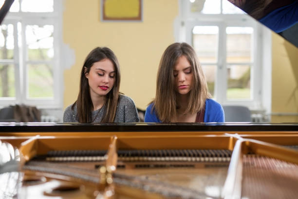 istock Women playing the piano. 960500228