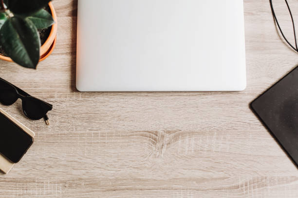 istock Freelance workplace concept flat lay for working with laptop, graphic tablet,notebook, glasses. illustration business. Designer office desk and IT gadgets. wooden table and office supplies top view 960516614