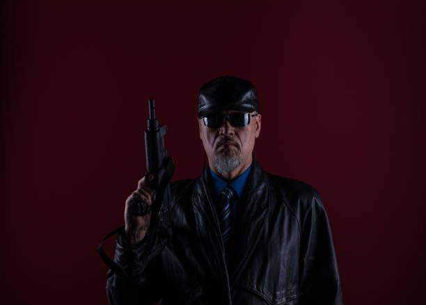 shadow portrait of the killer with a gun