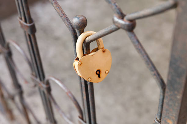 yellow heart-shaped pendant hanging on the gate