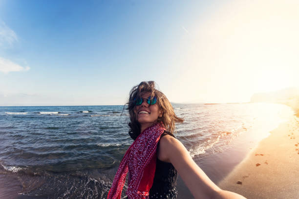 istock Happy woman in summer vacation taking selfie 960530868