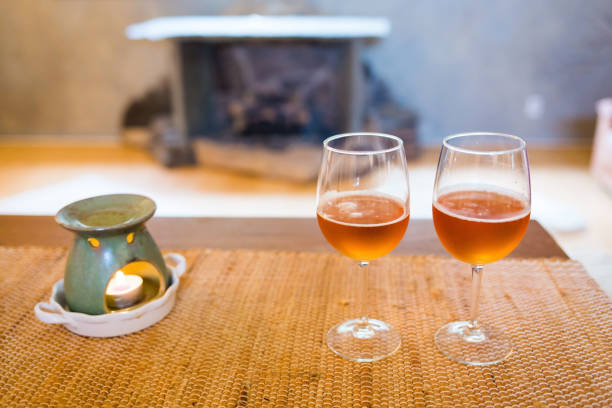 istock Beer glasses with aroma lamp romantic time at fireplace 960532140
