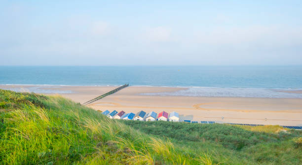 istock Beach cabins along hilly dunes on a recreational beach in sunlight in spring 960532378