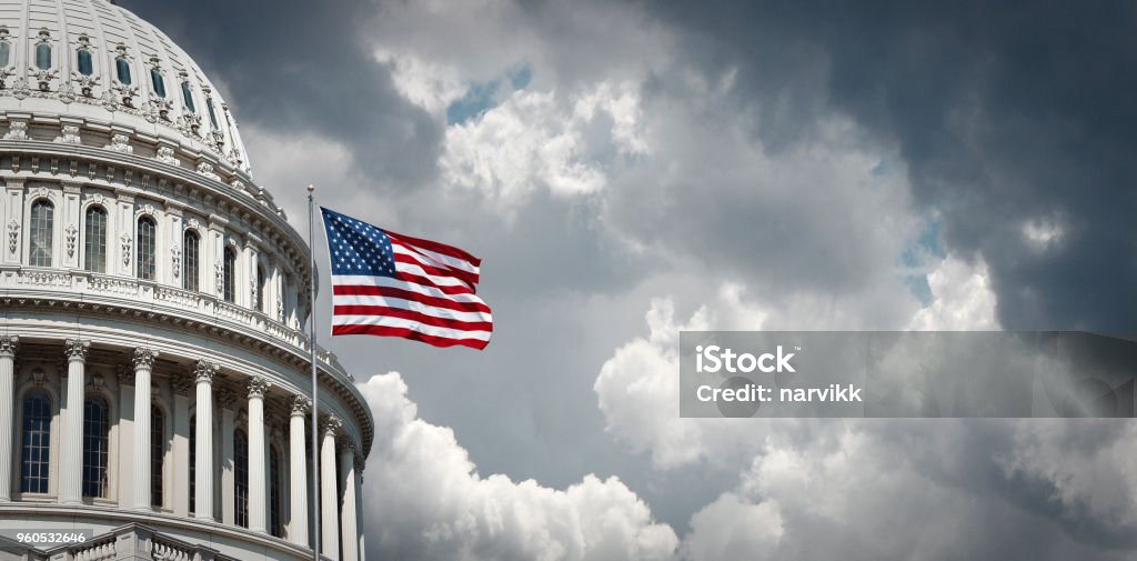 US Capitol and waving american flag Panoramic view of the United States Capitol and waving american flag in Washington DC USA Stock Photo