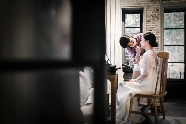 Wedding makeup artist making a make up for bride