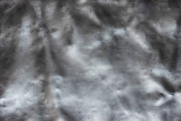 istock Dark steel plate background, black crumpled metal texture 960540244