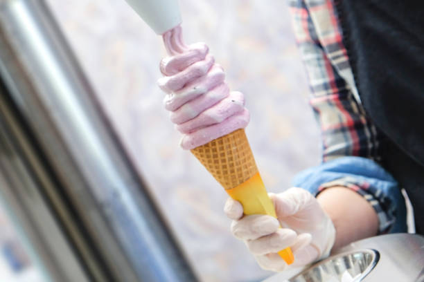 istock Young women making a fresh soft ice cream sundae 960540376