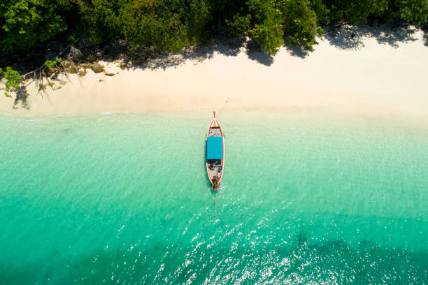 Long tail boat on the beach.Wonderful background.Aerial view from Andaman beach. Long tail boat on the beach.Wonderful background.Aerial view from Andaman beach. andaman sea stock pictures, royalty-free photos & images