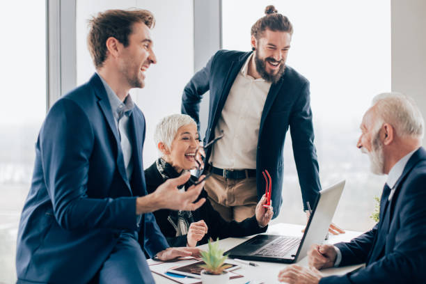 istock Business people smiling at office 960564852