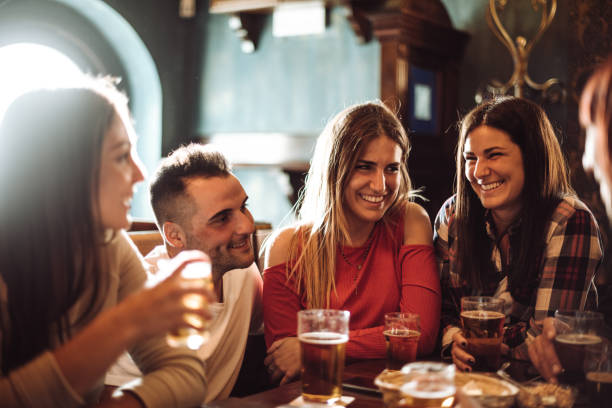 istock people talking indoors in a pub with the beers 960567280