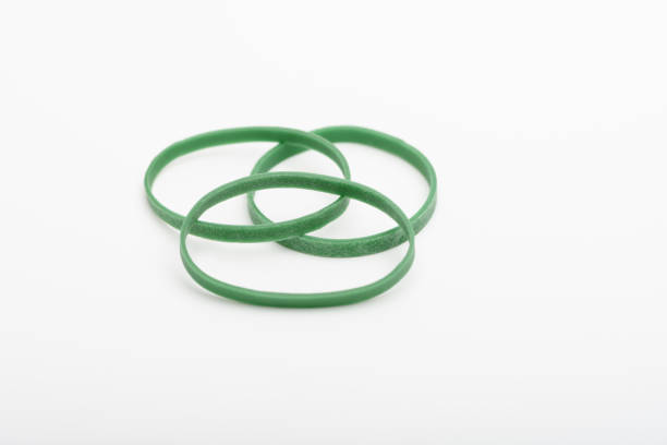 istock Green color rubber bands isolated on white background. 960567414