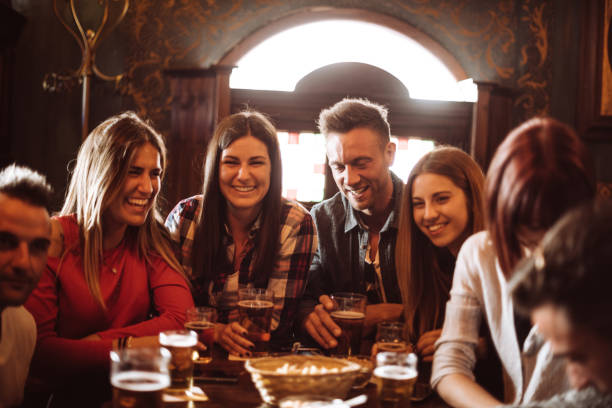 istock people talking indoors in a pub with the beers 960567610