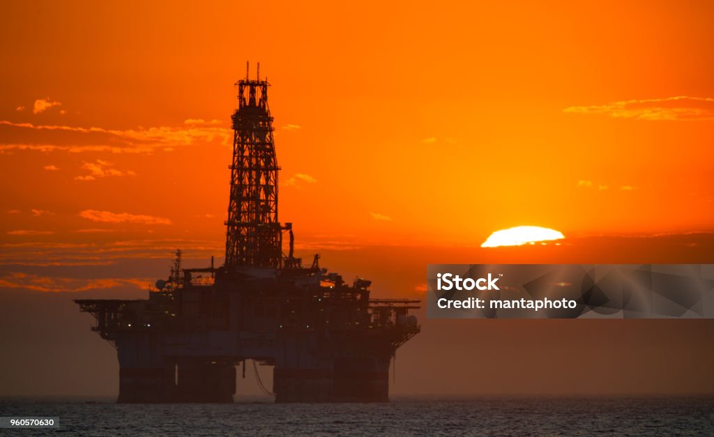 Oil Platform at Sunset Offshore Platform Stock Photo