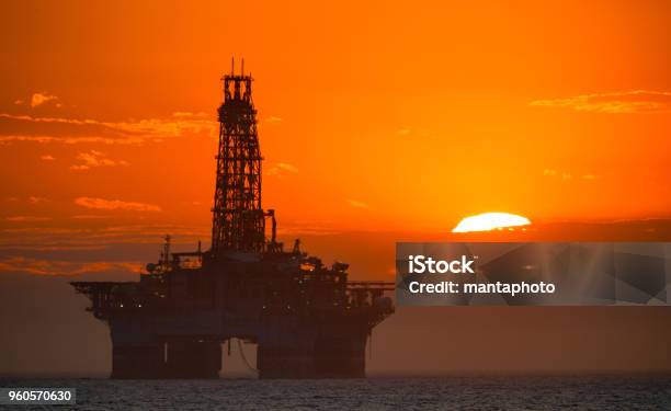 Oil Platform At Sunset Stock Photo - Download Image Now - Offshore Platform, Crude Oil, Drilling Rig