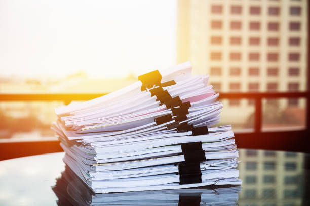 istock Pile of unfinished documents on office desk, Stack of business paper 960572302
