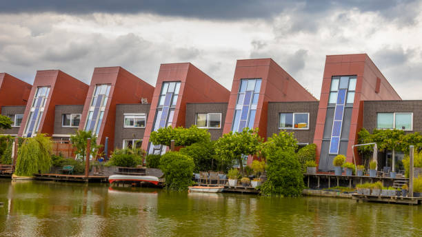 Waterfront houses with integrated solar panels and hanging gardens on waterfront in urban area of The Hague, Netherlands