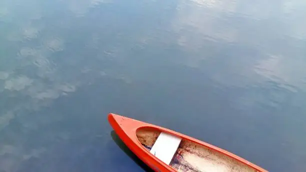 Red Boat on the river (canoe boat)