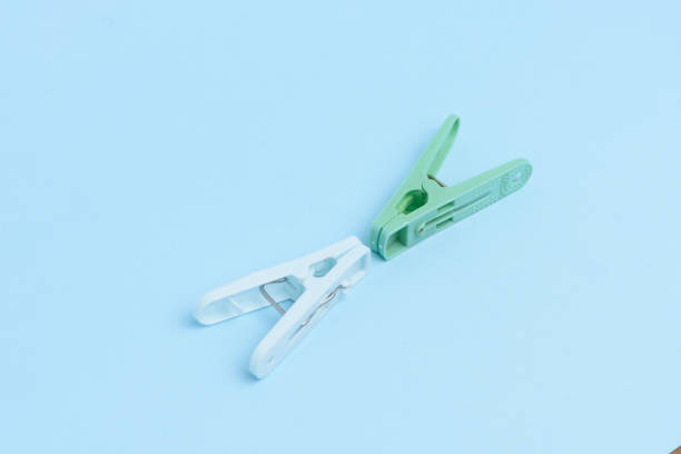 istock Cloths pegs isolated on light color background. 960575670